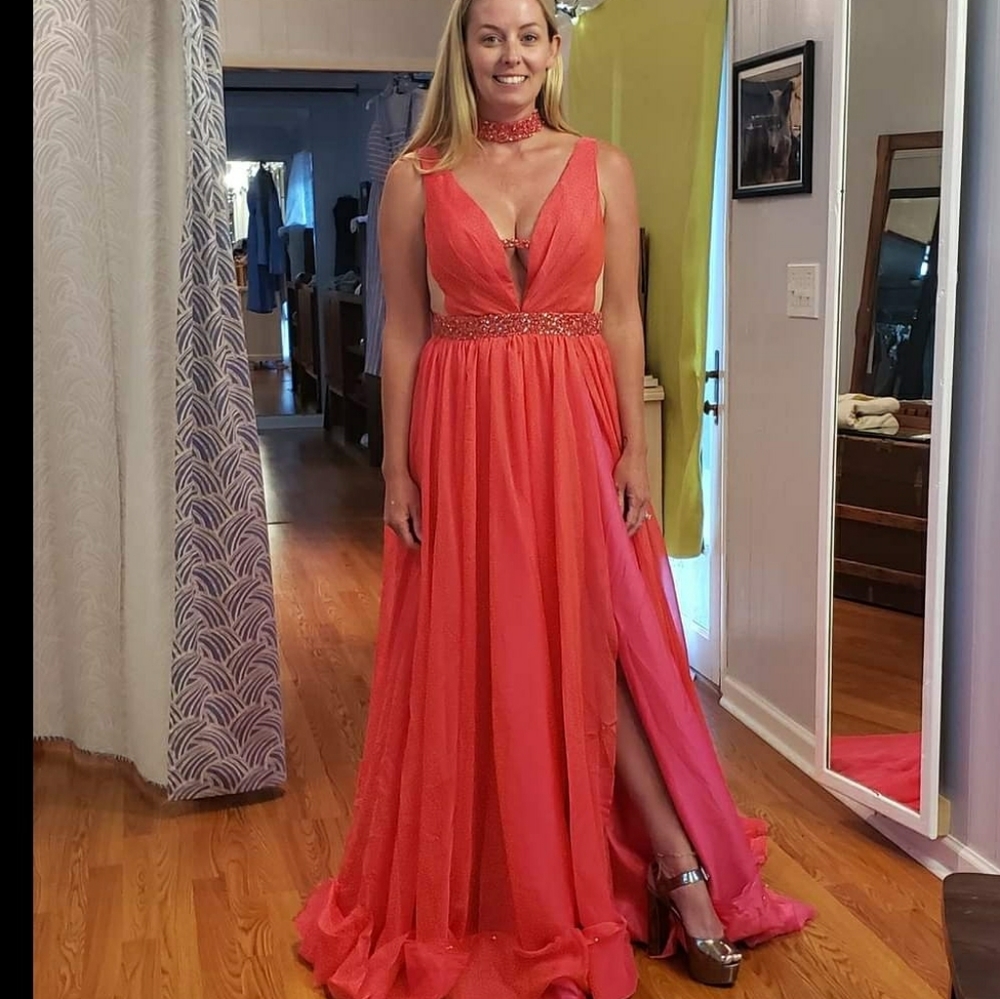 Custom red gown with hot pink underlay.